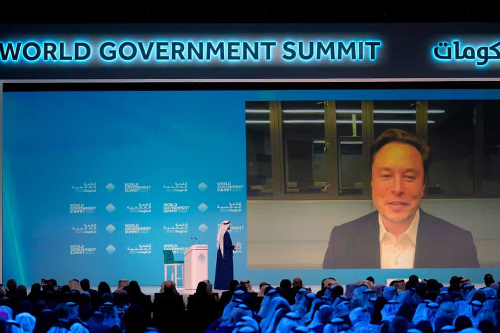 Elon Musk talks virtually to Mohammad Al Gergawi, UAE minister of cabinet affairs, during the World Government Summit in Dubai, United Arab Emirates (Kamran Jebreili/AP)