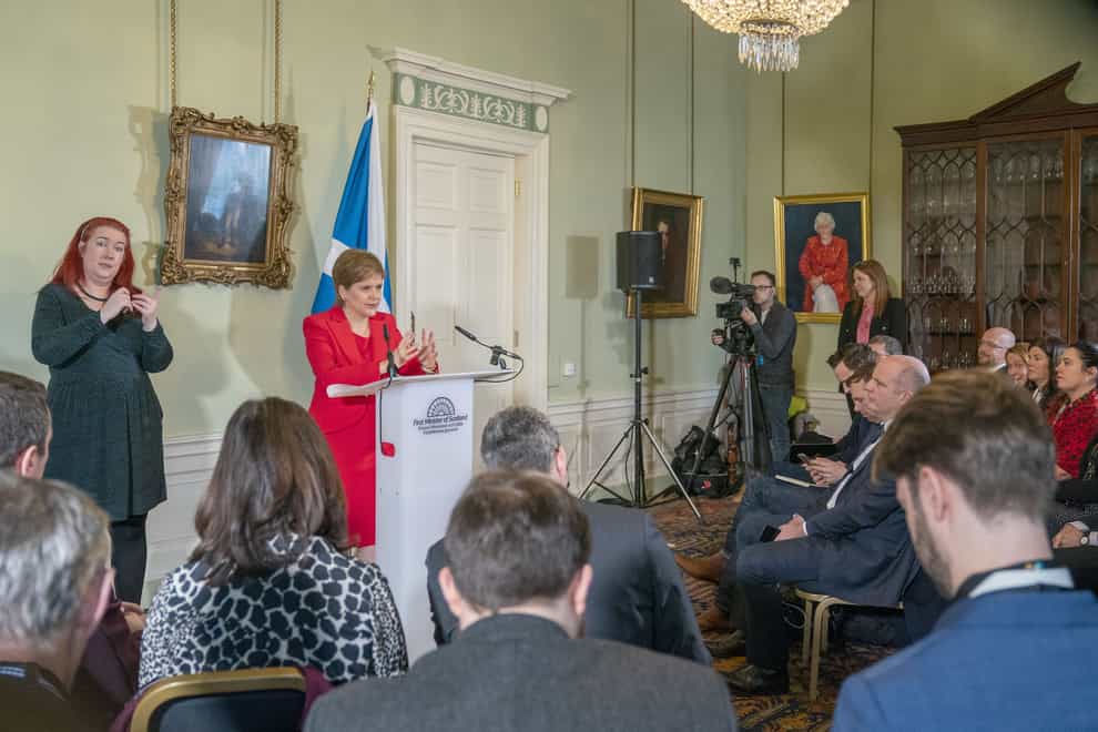 Nicola Sturgeon announces her intention to resign as First Minister to a room packed with journalists (Jane Barlow/PA)