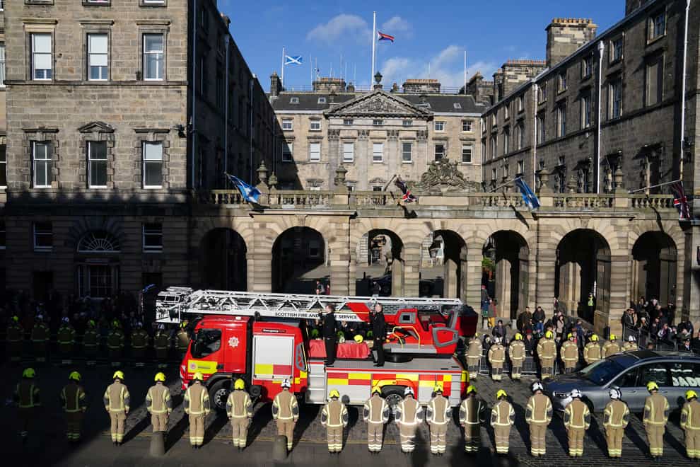 The coffin of Barry Martin arrives on a fire engine outside St Giles’ Cathedral (Jane Barlow/PA)