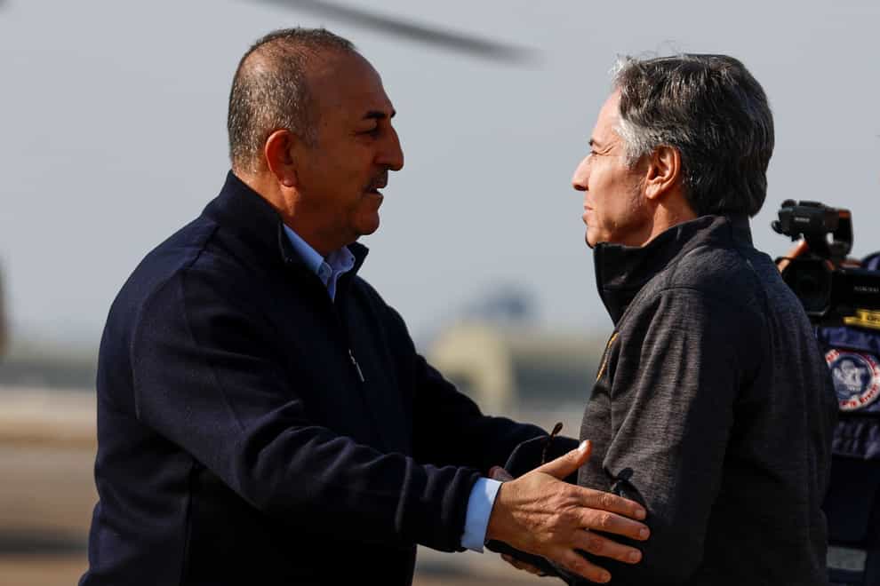 US Secretary of State Antony Blinken is greeted by Turkish Foreign Minister Mevlut Cavusoglu, at Incirlik Air Base (Clodagh Kilcoyne/Pool Photo via AP)