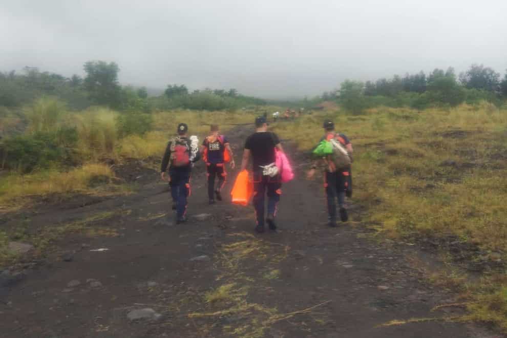 Rescuers continue their search for passengers of a Cessna 340 aircraft with registry number RP-C2080 at Tumpa Gulley, Camalig town, Albay province, the Philippines (Bureau of Fire Protection Camalig/AP)