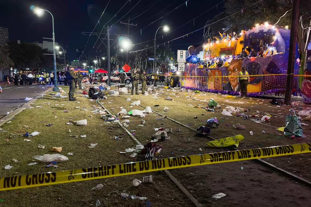 Police work the scene of a shooting at the Krewe of Bacchus parade (David Grunfeld/The Times-Picayune/The New Orleans Advocate/AP)