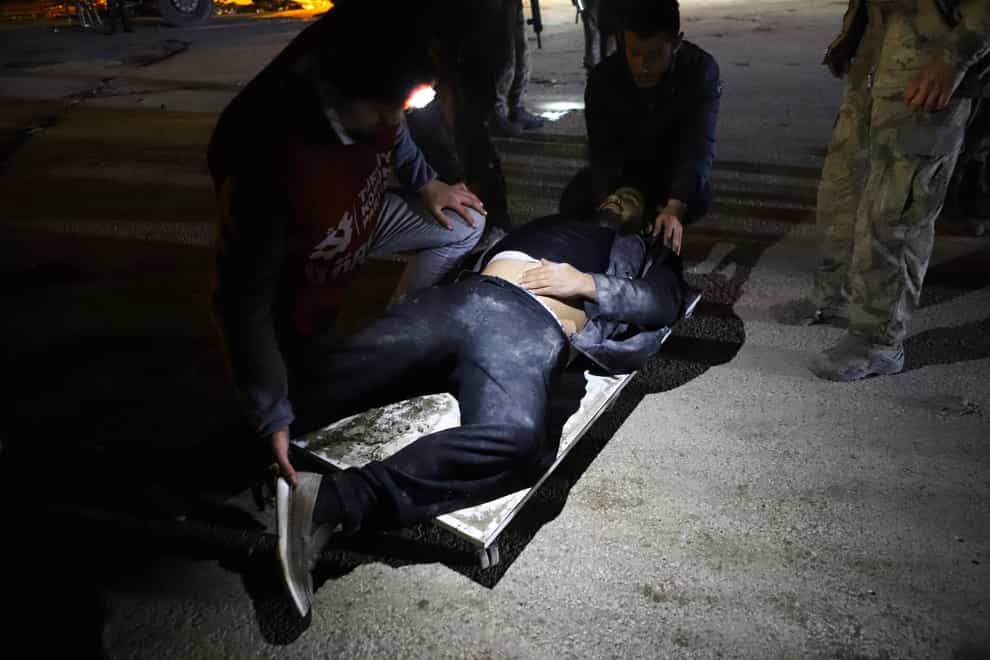 A man being treated after being hurt in the latest earthquake in Hatay, Turkey (Efekan Akyuz/Depo Photos/AP)