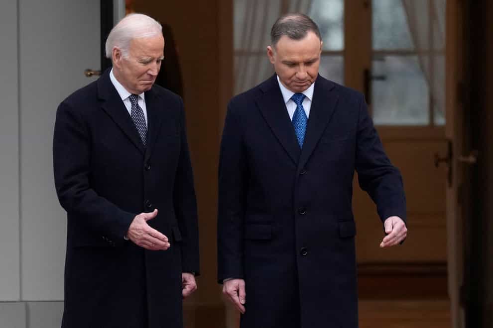 Polish President Andrzej Duda, right, welcomes President Joe Biden at the Presidential Palace in Warsaw (Czarek Sokolowski/AP)