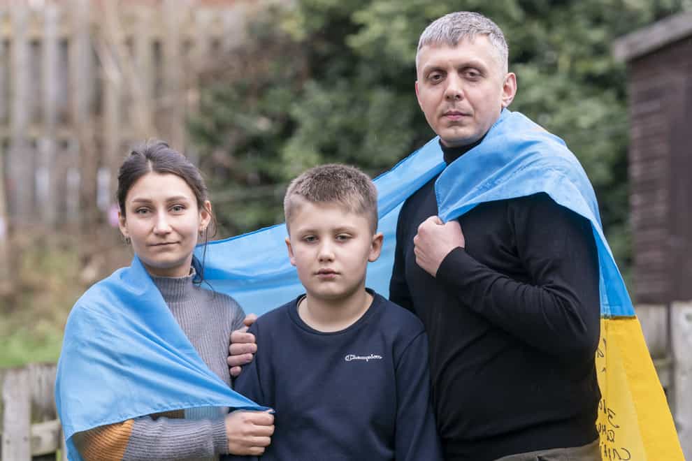 Ukrainian refugees Pavlo Romaniukha (left) with his wife Rymma Parkhomenko-Romaniukha and their son Dmytro (Danny Lawson/PA)