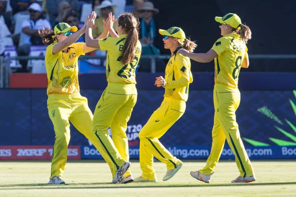 Australia players celebrate after victory in the T20 World Cup semi-final against India (Halden Krog/AP/PA)