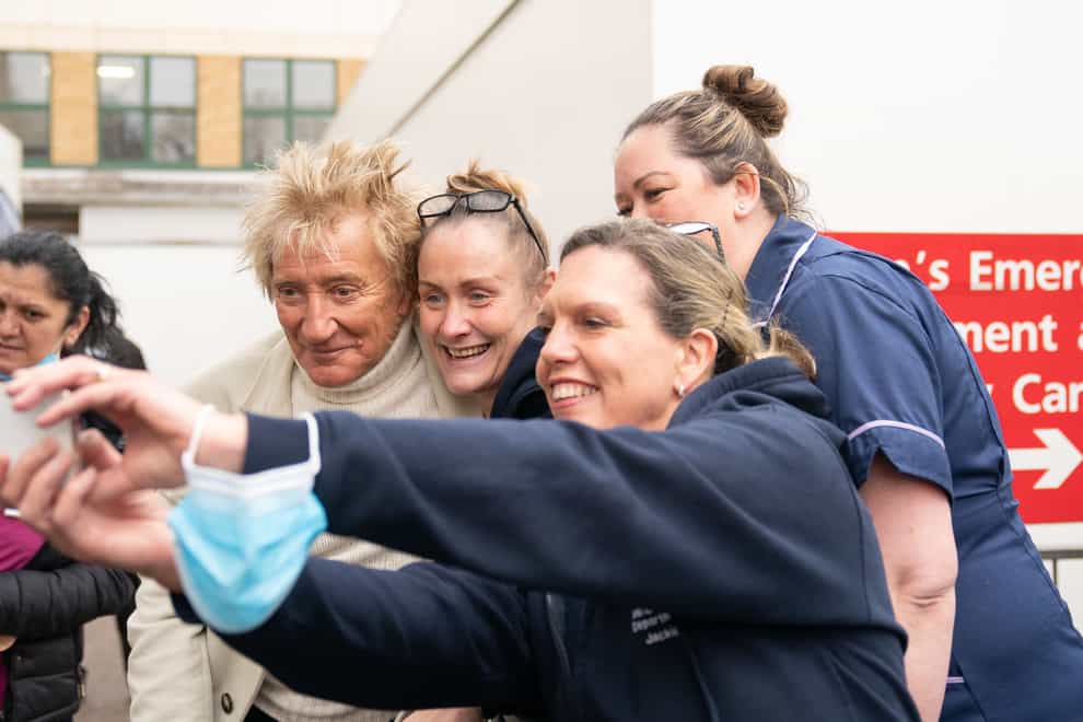 Sir Rod Stewart poses for a selfie with medics at the Princess Alexandra Hospital in Harlow, Essex (Joe Giddens/PA)