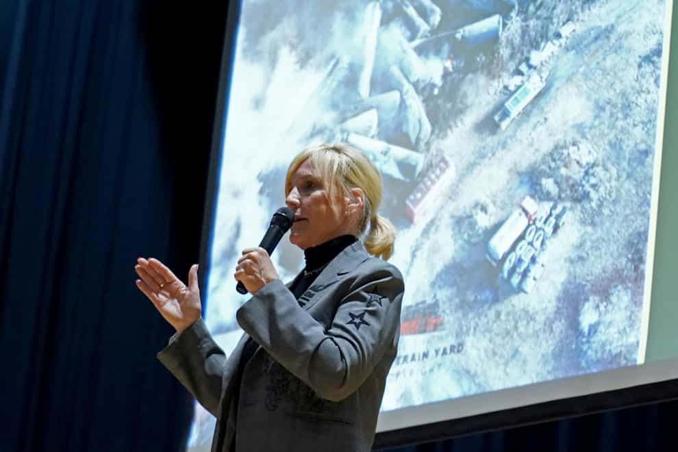 Activist Erin Brockovich speaks during a town hall meeting at East Palestine High School concerning the February 3 Norfolk Southern freight train derailment in East Palestine, Ohio (Matt Freed/AP)