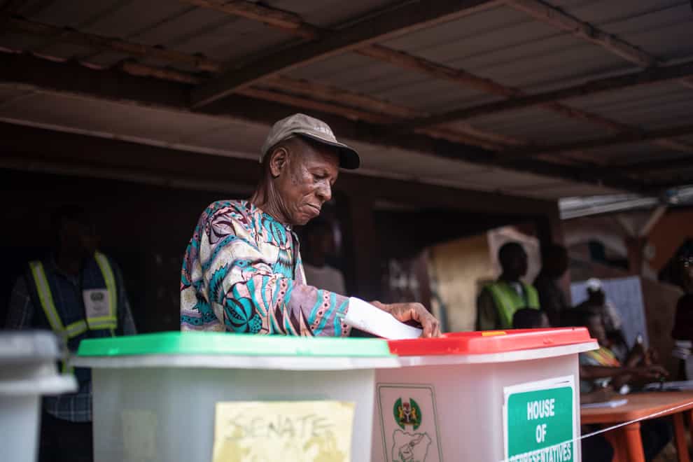 A man casts his vote during the presidential elections in Agulu, Nigeria (Mosa’ab Elshamy/AP)