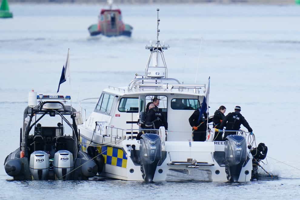 Divers searching the water after a tugboat capsized have recovered the bodies of two men (Jane Barlow/PA)