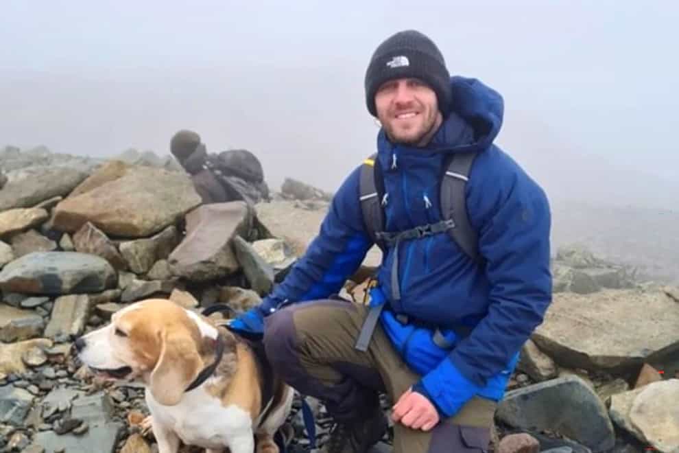 Kyle Sambrook, 33, with his beagle called Bane (Police Scotland/PA)