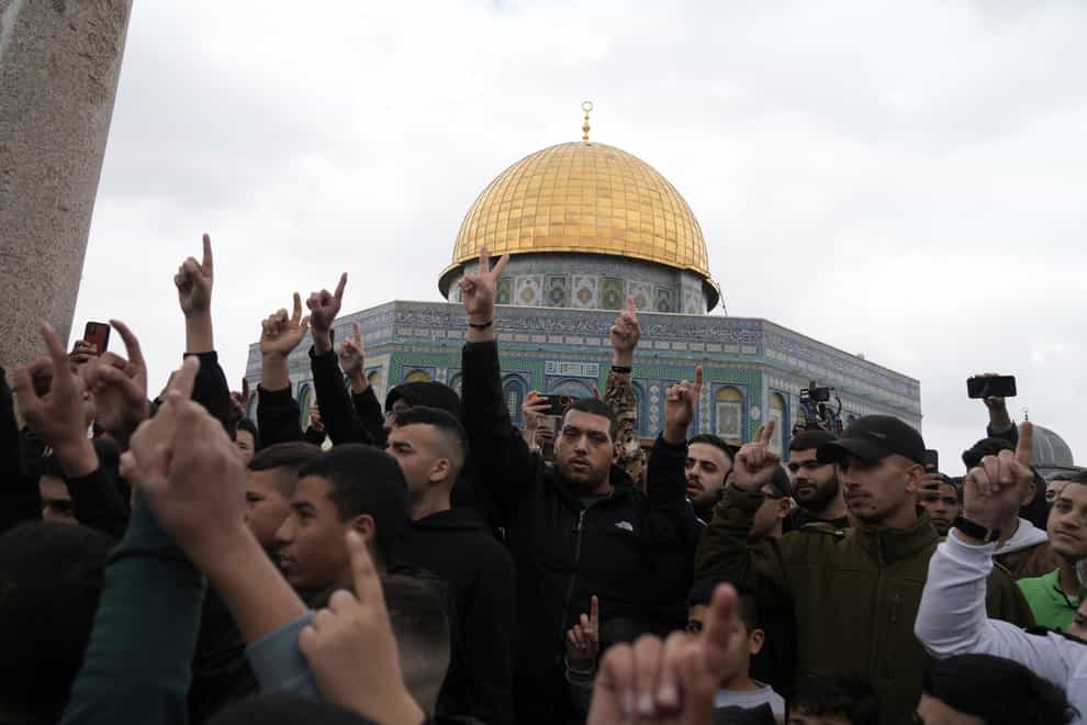 Palestinians protest a deadly Israeli raid in the West Bank city of Nablus, as well as a crackdown on Palestinian prisoners by Israel’s right-wing government, following Friday prayers at the Dome of the Rock Mosque in the Al-Aqsa Mosque compound in the Old City of Jerusalem (Mahmoud Illean/AP)