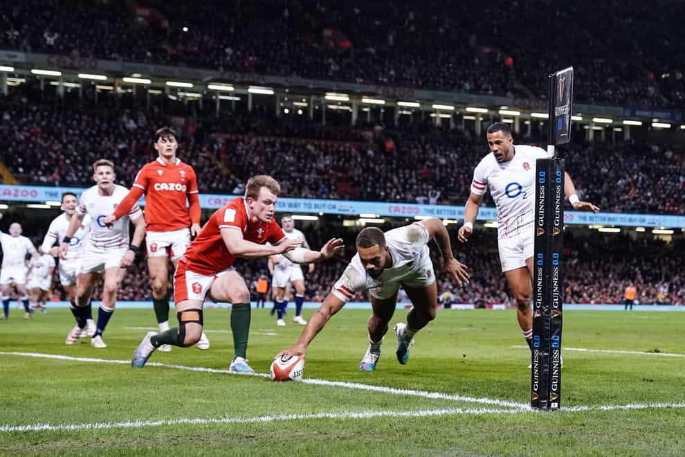 Ollie Lawrence scores England’s decisive third try against Wales (David Davies/PA)