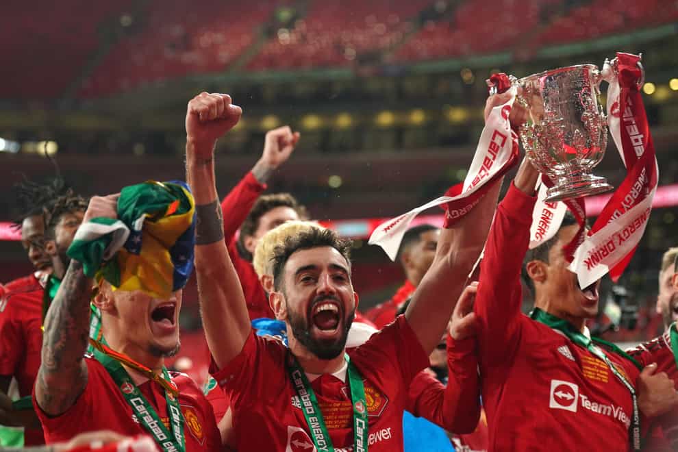Manchester United celebrate with the Carabao Cup (Owen Humphreys/PA)