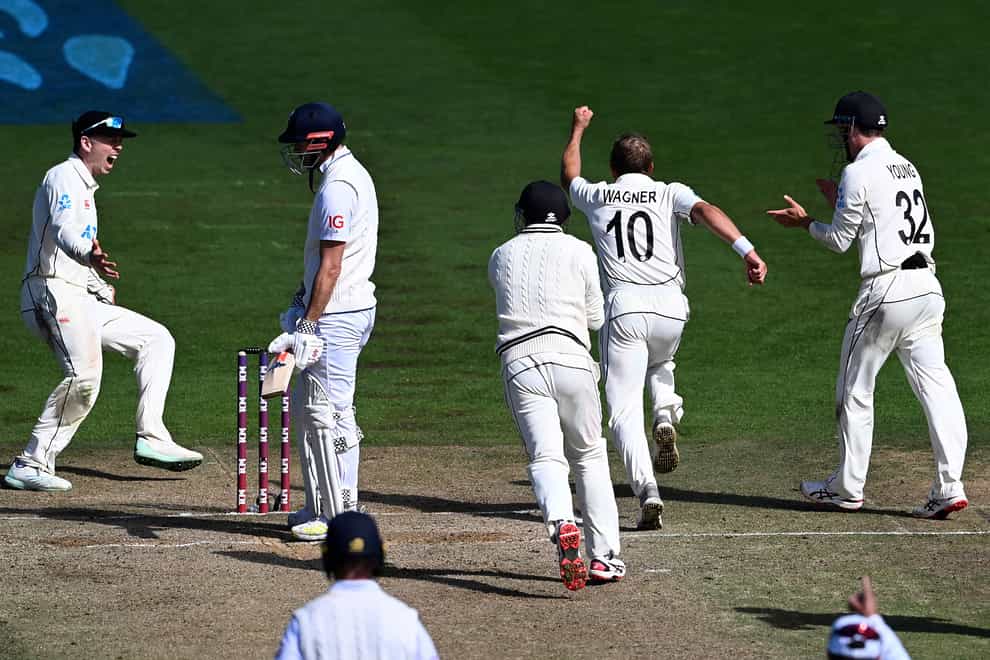 Neil Wagner, second right, celebrates with the wicket of James Anderson (Andrew Cornaga/Photosport/AP)