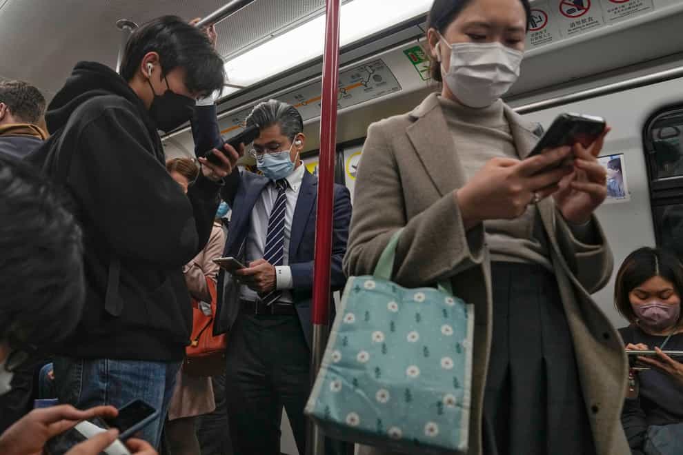 Commuters will no longer have to wear masks (Andy Wong/AP)