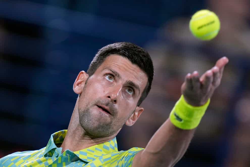 Novak Djokovic serves to Tomas Machac (Kamran Jebreili/AP)