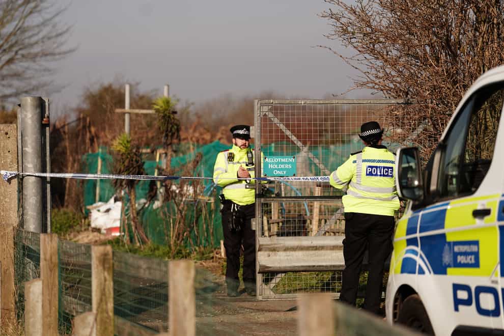 Police officers put up crime scene tape at set of allotments, at the north of Shenfield Way, near to the scene in Brighton, East Sussex, where remains have been found in the search for the two-month-old baby of Constance Marten and Mark Gordon. The pair were arrested on suspicion of gross negligence manslaughter after being stopped without the baby in Brighton on Monday following several weeks of avoiding the police. Picture date: Thursday March 2, 2023.