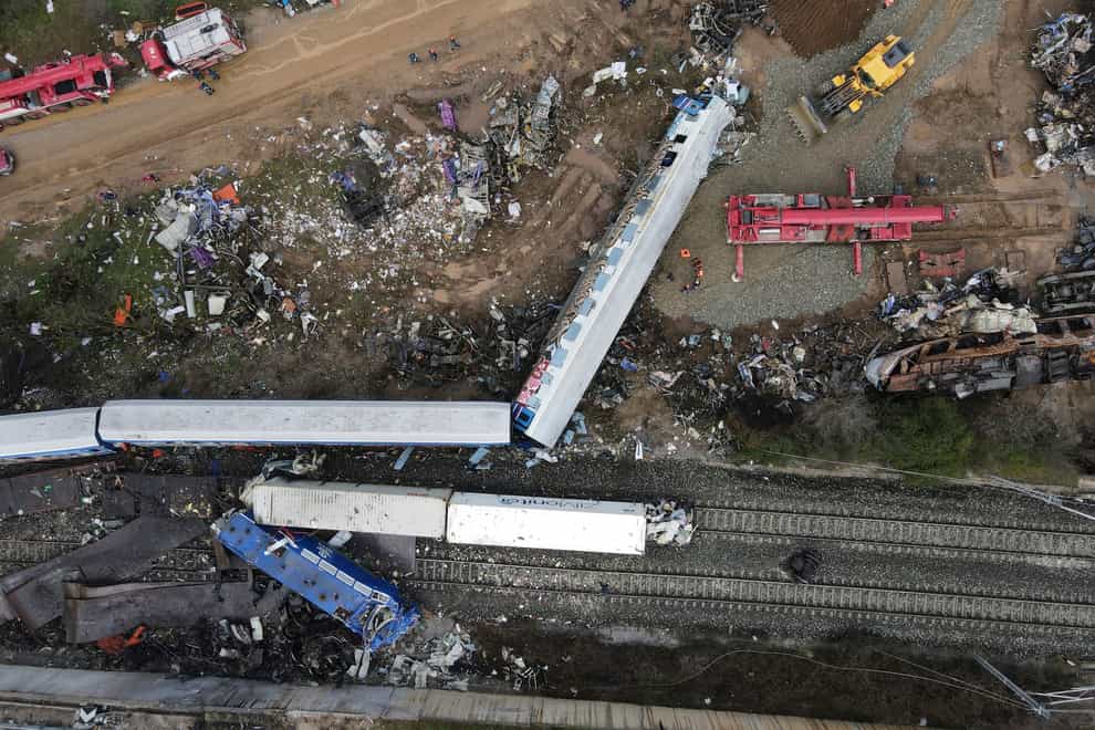 The wreckage of the trains lie on the rail lines after Tuesday’s horror crash (AP Photo/Giannis Papanikos)
