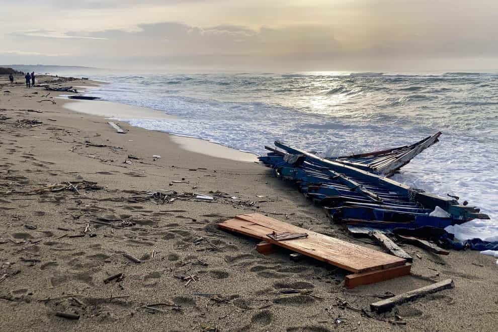 Part of the wreckage of the boat that washed ashore in southern Italy (Paolo Santalucia/AP)