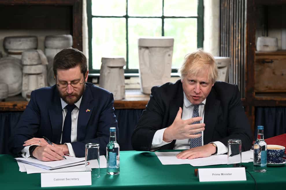 Then-prime minister Boris Johnson (right) and Cabinet Secretary Simon Case (Oli Scarff/PA)