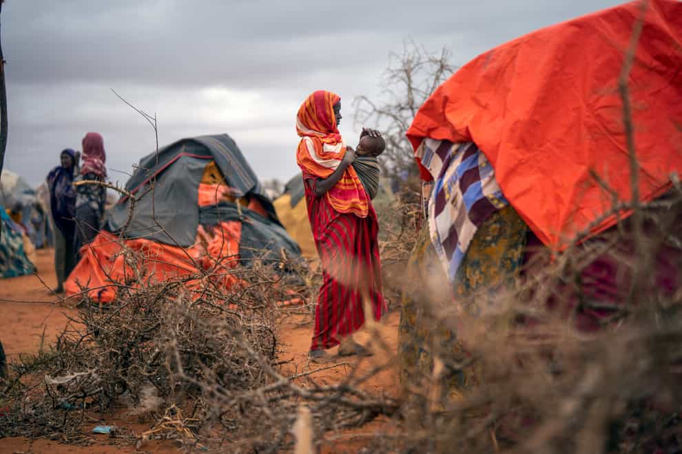 A Somali woman breastfeeds her child at a camp for displaced people on the outskirts of Dollow (Jerome Delay/AP)