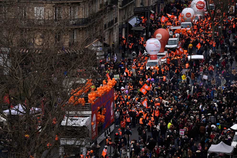 Demonstrators march through Paris (Lewis Joly/AP)