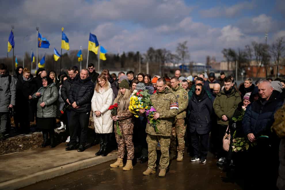 Mourners gather for the funeral of 29 year old Yana Rikhlitska, a Ukrainian army medic killed in the Bakhmut area of Ukraine (Thibault Camus/AP)