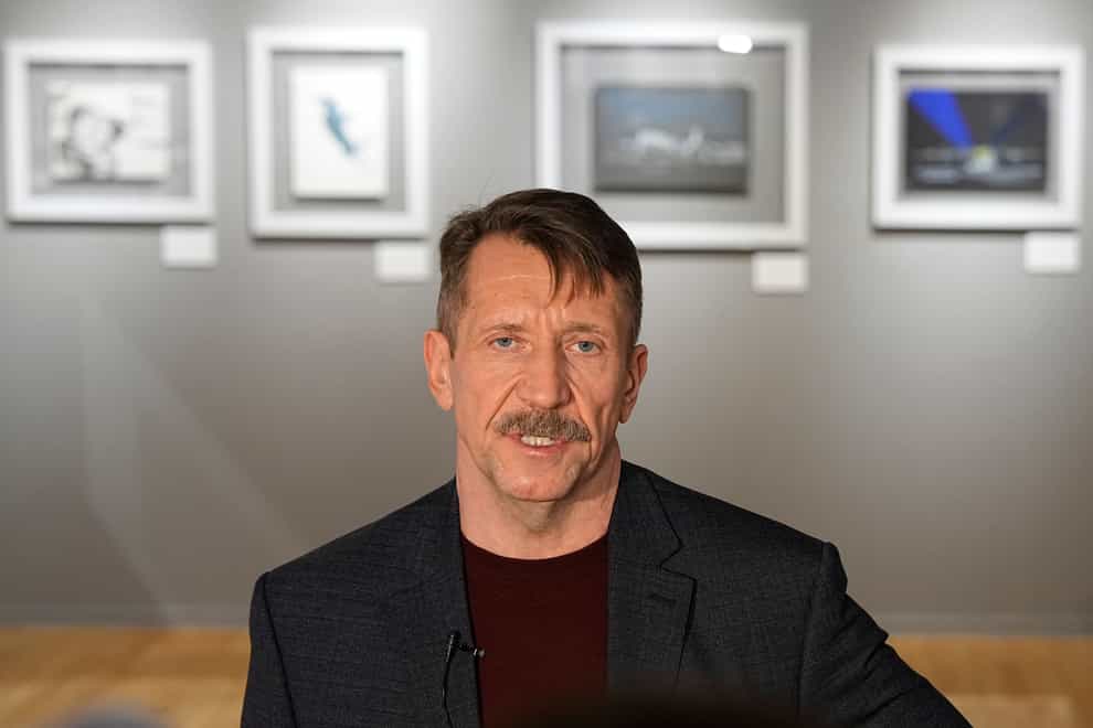 Viktor Bout, a Russian arms dealer who was sentenced to 25 years in prison in the United States, speaks to the media prior to an opening ceremony of the exhibition of his artworks at the Mosfilm studio in Moscow (Alexander Zemlianichenko/AP)