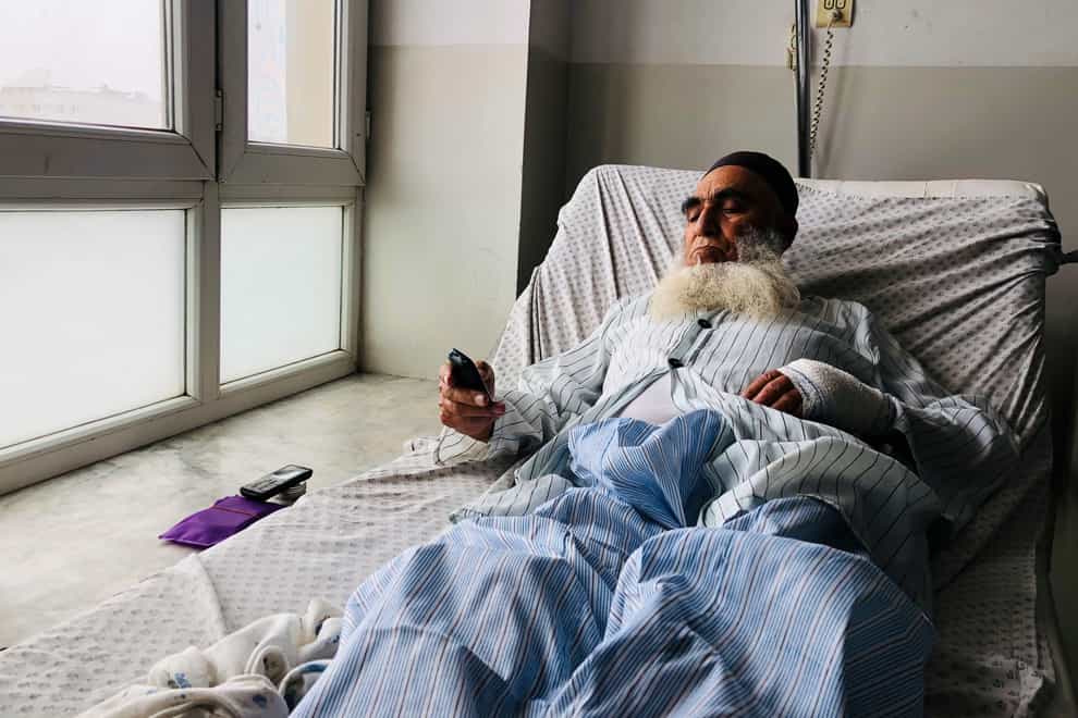 A wounded man receives treatment at a hospital after a bomb blast in Mazar-e Sharif, the capital city of Balkh province, northern Afghanistan (Abdul Saboor Sirat/AP)
