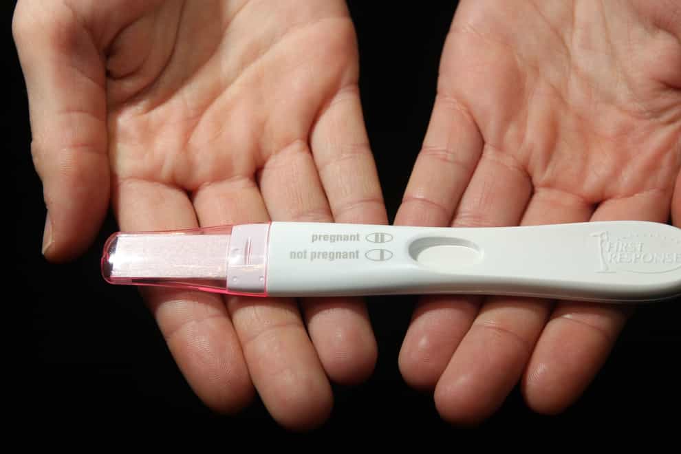 A home pregnancy test, and its instructions (Dominic Lipinski/PA)