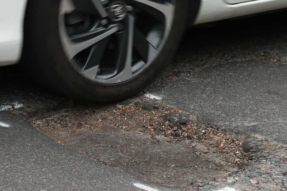 Councils repair a pothole every 19 seconds, the LGA said (Yui Mok/PA)