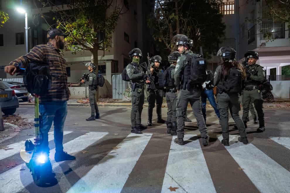 Israeli security forces search for a suspect in a shooting attack in Tel Aviv (Oded Balilty/AP)