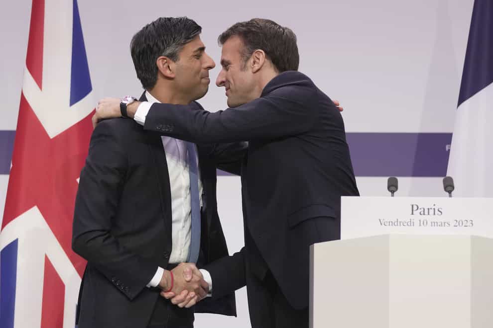 Prime Minister Rishi Sunak and President Emmanuel Macron embrace (Kin Cheung/PA)