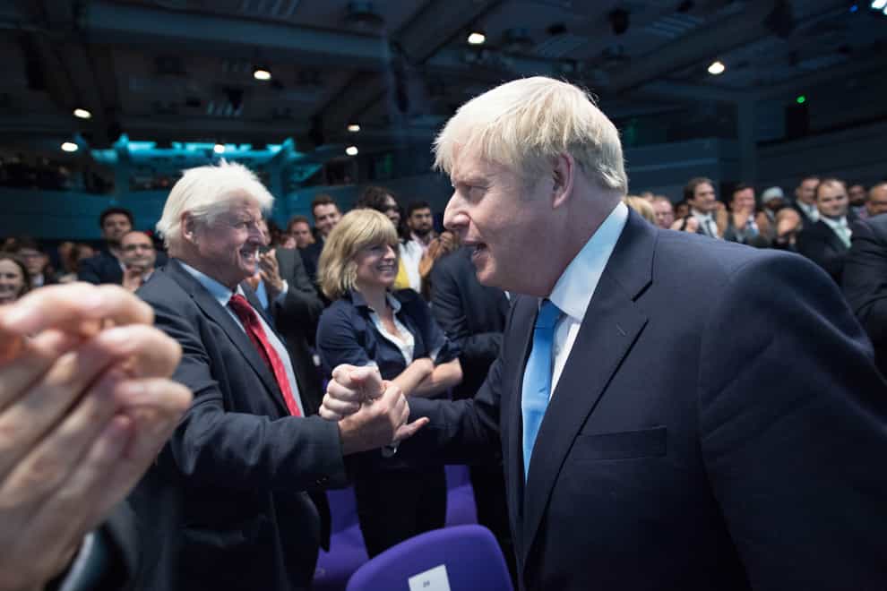 Boris Johnson shakes hands with his father Stanley Johnson (PA)