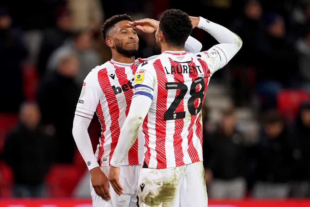 Stoke City’s Tyrese Campbell (left) celebrates scoring his sides third goal with team mate Josh Laurent during the Sky Bet Championship match at the bet365 Stadium, Stoke-on-Trent. Picture date: Friday March 10, 2023.