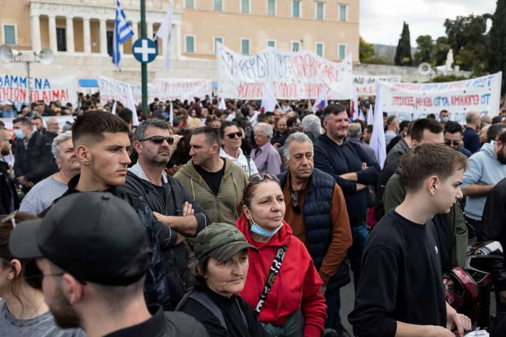 Protesters take part in a rally following a train collision in central Greece, in front of the parliament, in Athens (Yorgos Karahalis/PA)