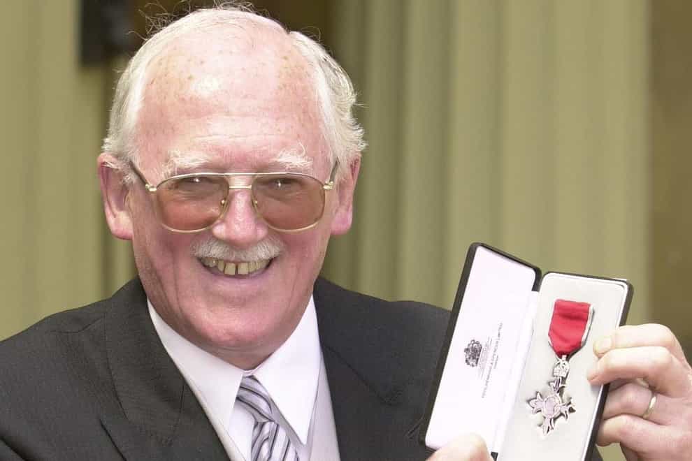 Cartoonist Bill Tidy after being presented with his MBE by the Queen in 2000 (John Stillwell/PA)