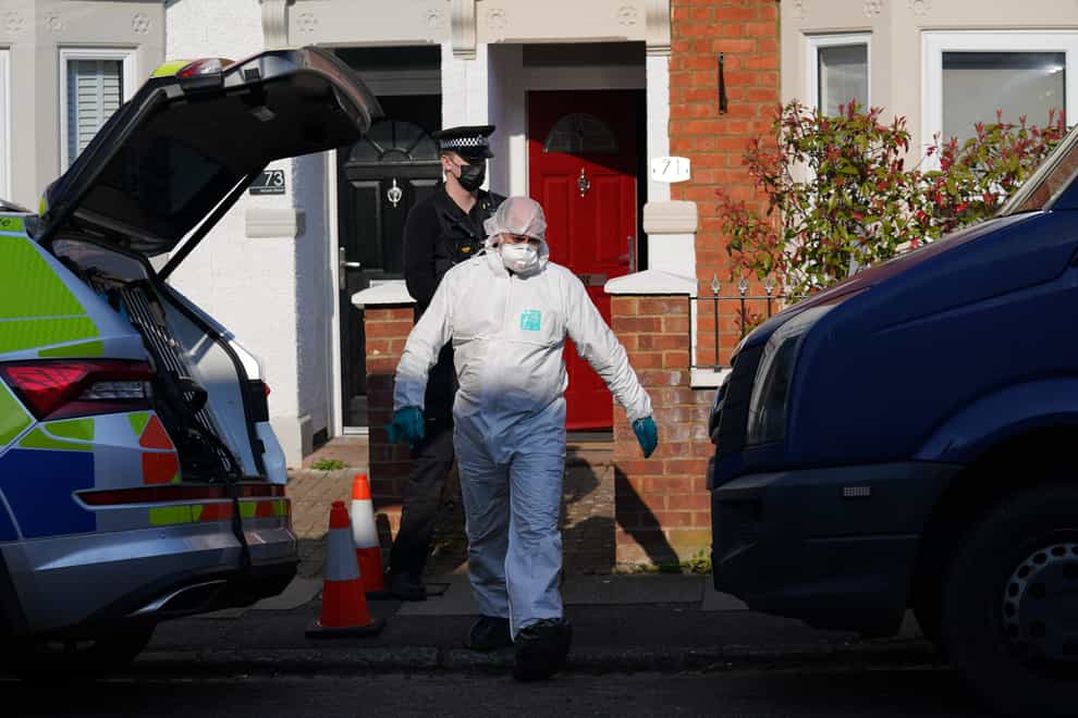 Forensic officers at the scene in Moore Street, Kingsley, Northampton following a discovery of a body in a rear garden (Northamptonshire Police/PA)