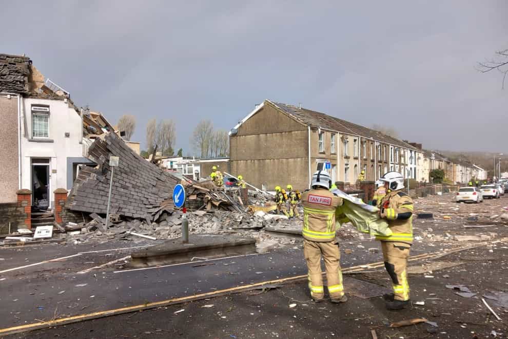 Emergency personnel at the scene after reports of a suspected gas explosion at a property on the junction of Clydach Road and Field Close in Morriston, Swansea. Issue date: Monday March 13, 2023.