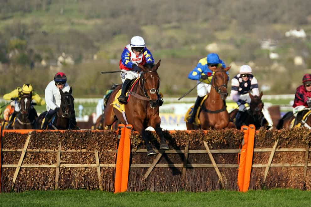 Love Envoi ridden by Jonathan Burke clears a fence before going on to win the Ryanair Mares’ Novices’ Hurdle during day three of the Cheltenham Festival at Cheltenham Racecourse (Tim Goode/PA)