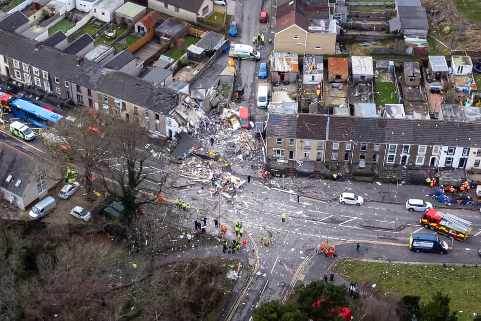 Emergency personnel at the scene after reports of a suspected gas explosion at a property on the junction of Clydach Road and Field Close in Morriston, Swansea (Ben Birchall/PA)