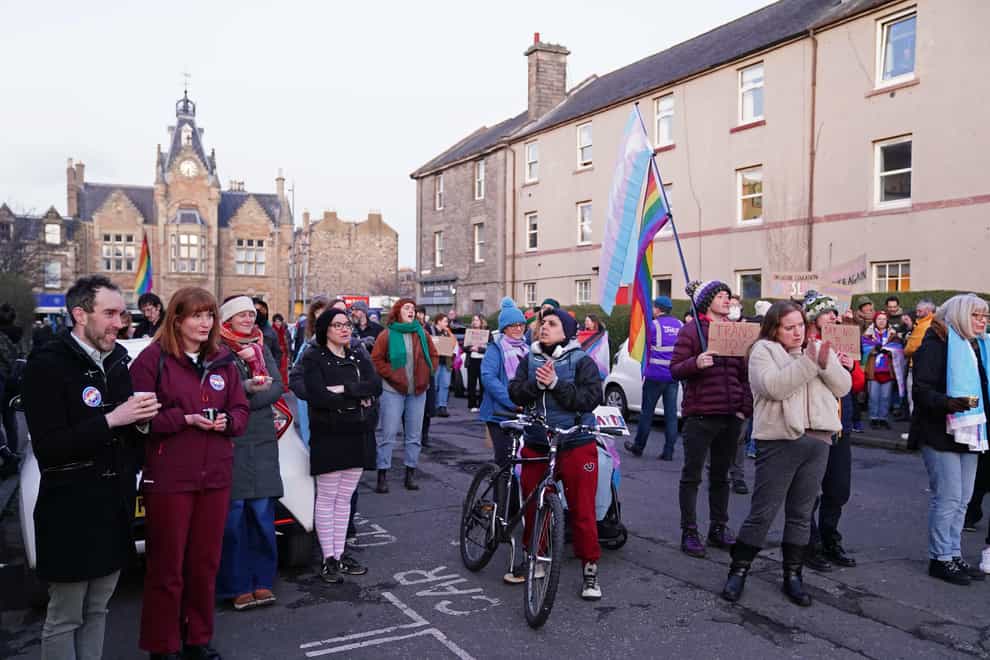 Trans rights activists take part in a demonstration outside Portobello Library, Edinburgh, where parents are attending a meeting, organised by Concerned Adults Talking Openly About Gender Identity Ideology, to discuss transgender ideology in Scottish schools (Jane Barlow/PA)