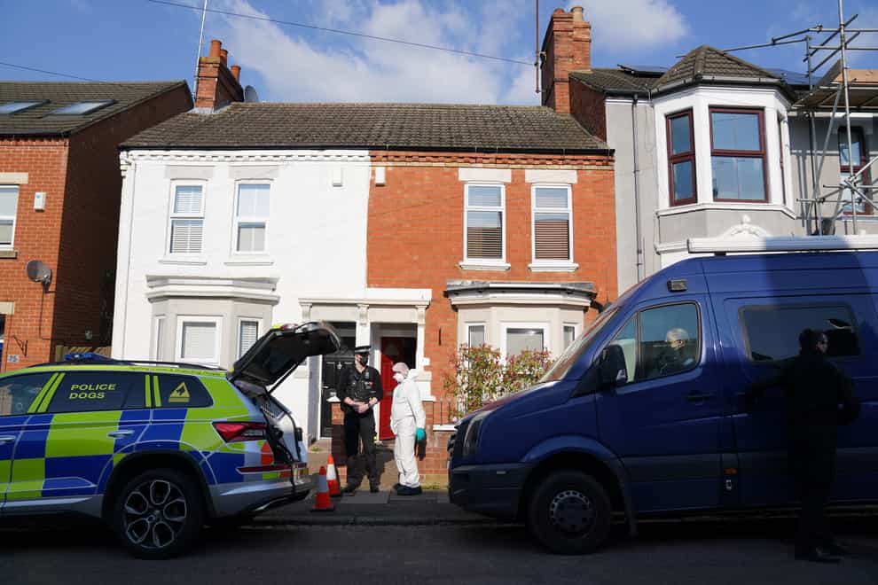 Forensic officers at the scene in Moore Street, Kingsley, Northampton following a discovery of a body in a rear garden (Jacob King/PA)