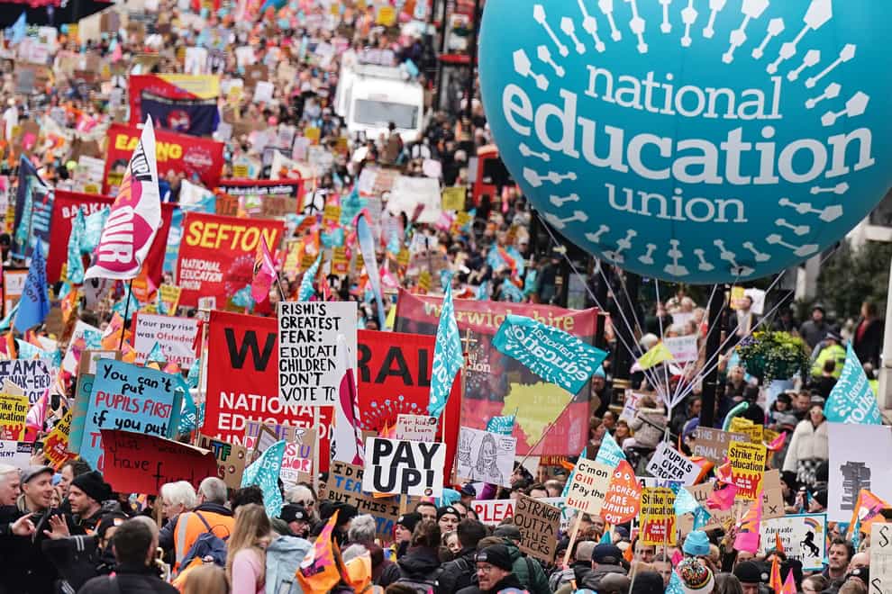 Striking members of the National Education Union on Piccadilly march to a rally in Trafalgar Square, central London, in a long-running dispute over pay (Aaron Chown/PA)