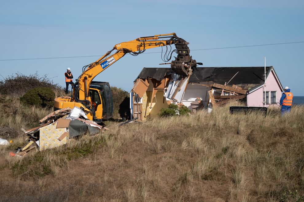 Three homes at risk of toppling into the sea in Norfolk were demolished over the weekend (Joe Giddens/ PA)