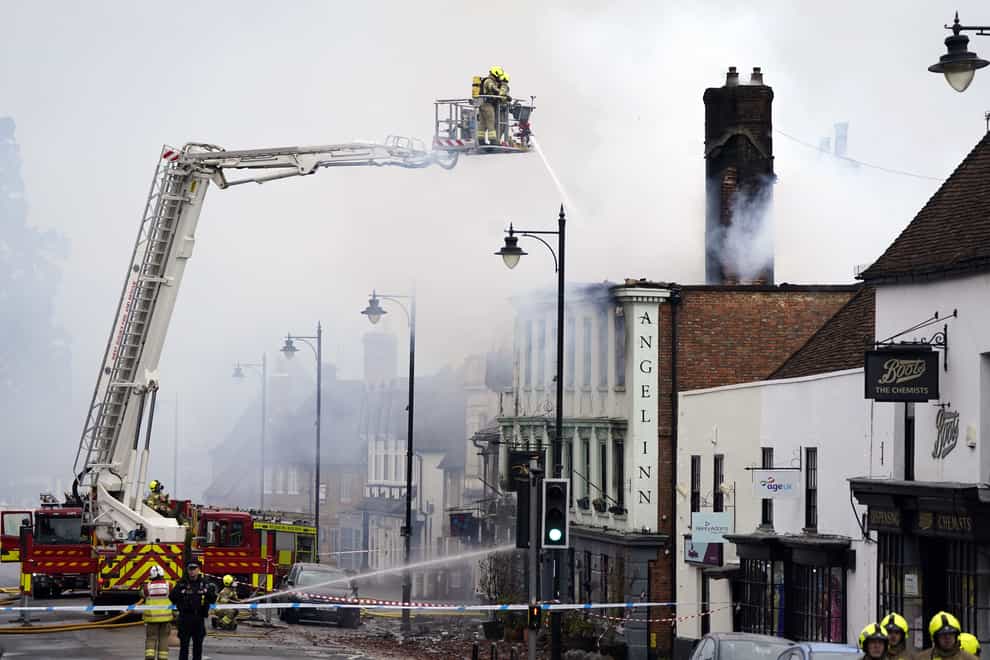 Firefighters dealing with a fire in Midhurst, West Sussex, which includes a 400-year-old hotel said to be housing Ukrainian refugees (Andrew Matthews/PA)