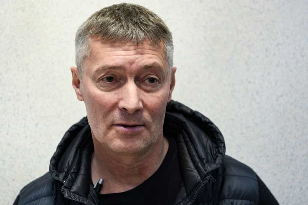 Yevgeny Roizman, former mayor of Russia’s fourth-largest city, stands prior to a court session in a courtroom in Yekaterinburg, Russia, Thursday, March 16, 2023. Roizman has been detained on charges that could land him behind bars as part of authorities’ efforts to muzzle dissent. Yevgeny Roizman is a sharp critic of the Kremlin and one of the most visible and charismatic opposition figures in Russia. (AP Photo/Vladimir Podoksyonov)
