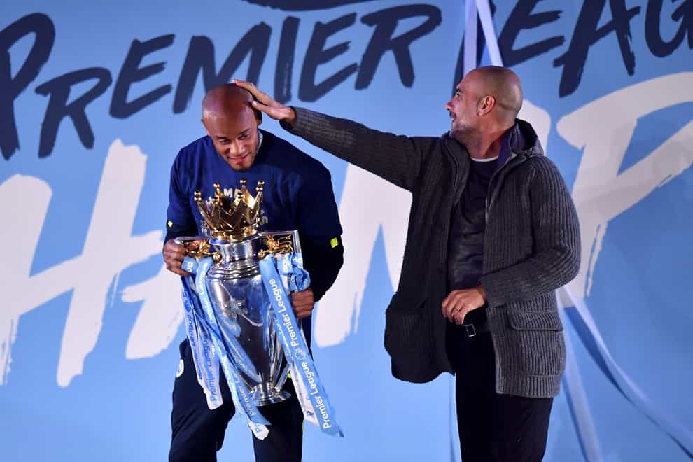 Vincent Kompany and Pep Guardiola with the Premier League trophy (Anthony Devlin/PA)
