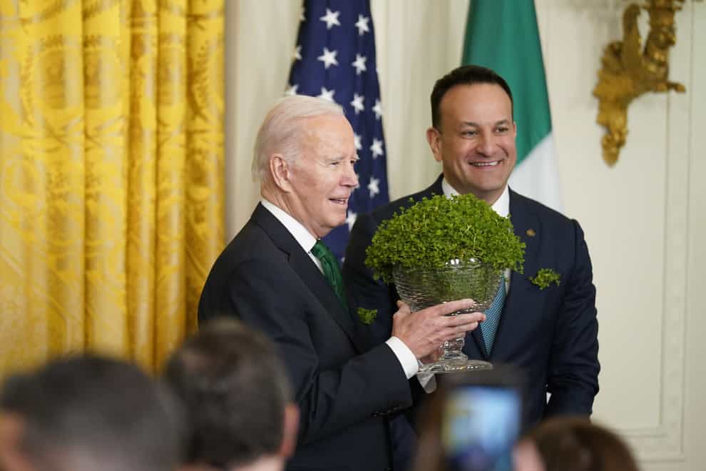 Taoiseach Leo Varadkar presents US President Joe Biden with a bowl of Shamrock (Niall Carson/PA)